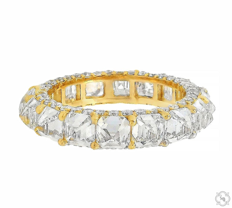 Yellow gold band with upside down Asscher cut diamonds encircling the ring