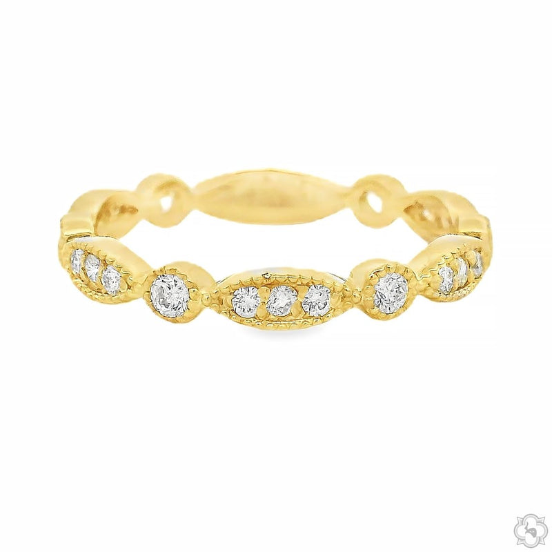 Yellow gold vintage-inspired diamond band with textured finish and round diamonds