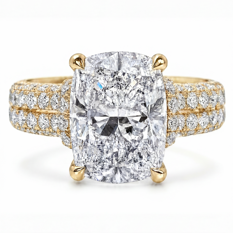 Rose gold engagement ring with large cushion-cut center diamond and triple pavé band.