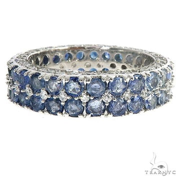 White gold eternity ring with two rows of round blue sapphire and diamond stones.