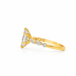 Gold engagement ring with marquise diamond center and small round diamonds on band.