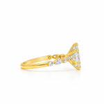 18k gold ring with 1 ct marquise diamond and smaller round diamonds on band.