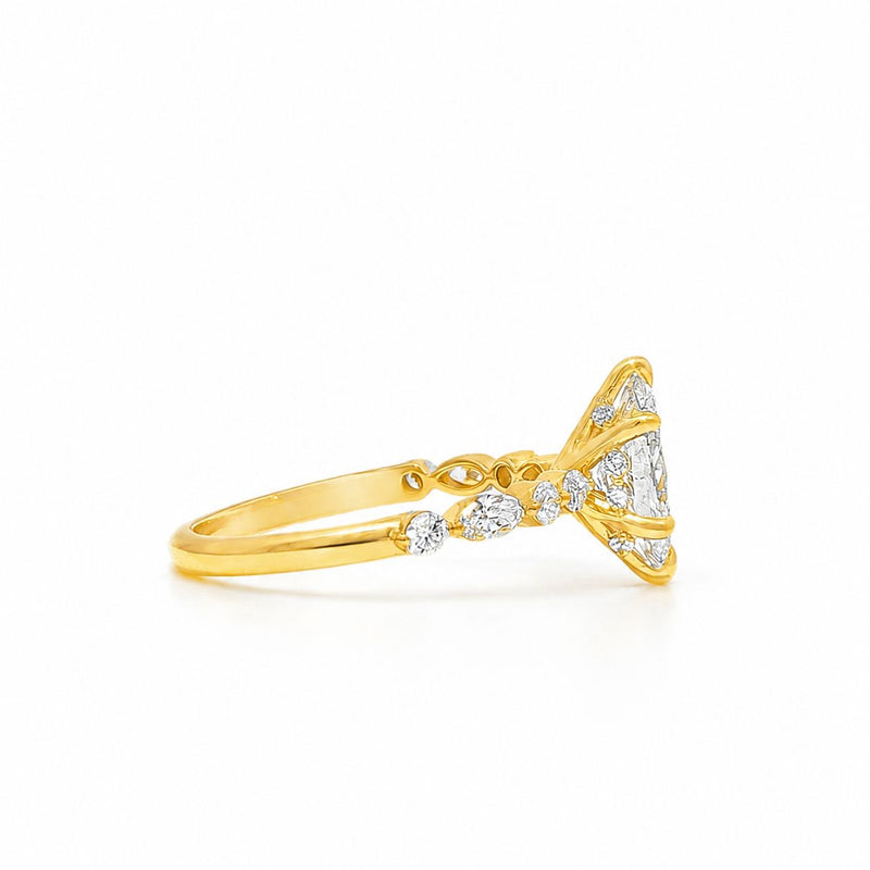 18k gold ring with 1 ct marquise diamond and smaller round diamonds on band.