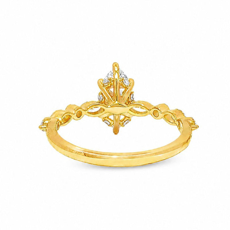 14k gold engagement ring with 1 ct marquise diamond and intricate filigree detailing.