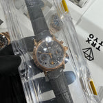Patek Philippe 5004R Grand Complications 38mm in 18K rose gold with grey chronograph dial on grey crocodile strap, displayed in clear protective packaging