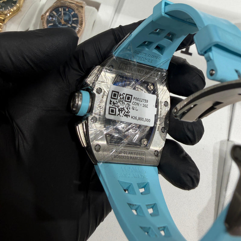 Richard Mille RM 11-01 on a light blue rubber strap, showcasing its bold colorway and football-inspired details.

