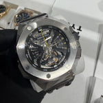 Audemars Piguet Royal Oak Concept Flying Tourbillon in titanium with a skeletonized dial, visible flying tourbillon, and bold yellow accents.

