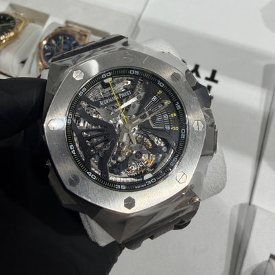 Audemars Piguet Royal Oak Concept Flying Tourbillon in titanium with a skeletonized dial, visible flying tourbillon, and bold yellow accents.

