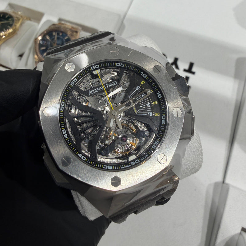 Audemars Piguet Royal Oak Concept Flying Tourbillon in titanium with a skeletonized dial, visible flying tourbillon, and bold yellow accents.

