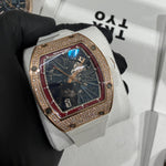Richard Mille RM 023 in 18K rose gold with a full diamond pavé tonneau case and skeletonized dial.

