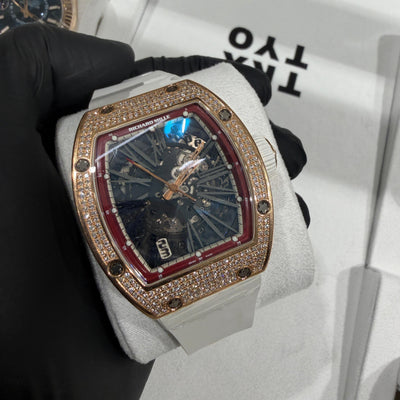 Richard Mille RM 023 in 18K rose gold with a full diamond pavé tonneau case and skeletonized dial.

