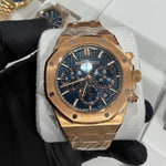 18K rose gold Audemars Piguet Royal Oak Chronograph with blue Tapisserie dial and integrated bracelet.