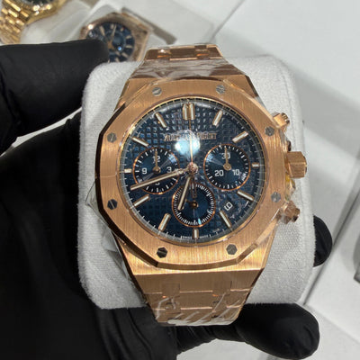 18K rose gold Audemars Piguet Royal Oak Chronograph with blue Tapisserie dial and integrated bracelet.
