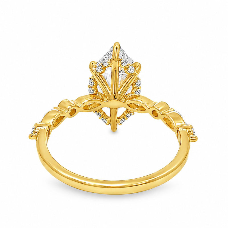 14K yellow gold ring with 2.5 Ct marquise diamond and intricate prong setting.