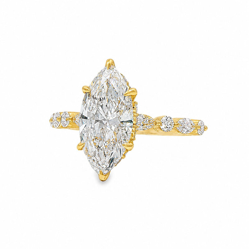 2.5 Ct marquise diamond ring in yellow gold with diamond-studded band for women.