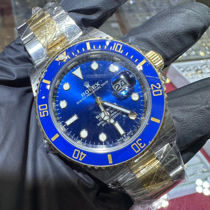 Rolex Submariner 41mm two tone yellow gold watch with blue dial and bezel, date display, luminous markers.