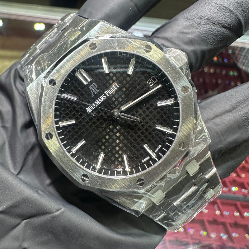 Audemars Piguet Royal Oak 41mm stainless steel watch with black textured dial and silver markers.