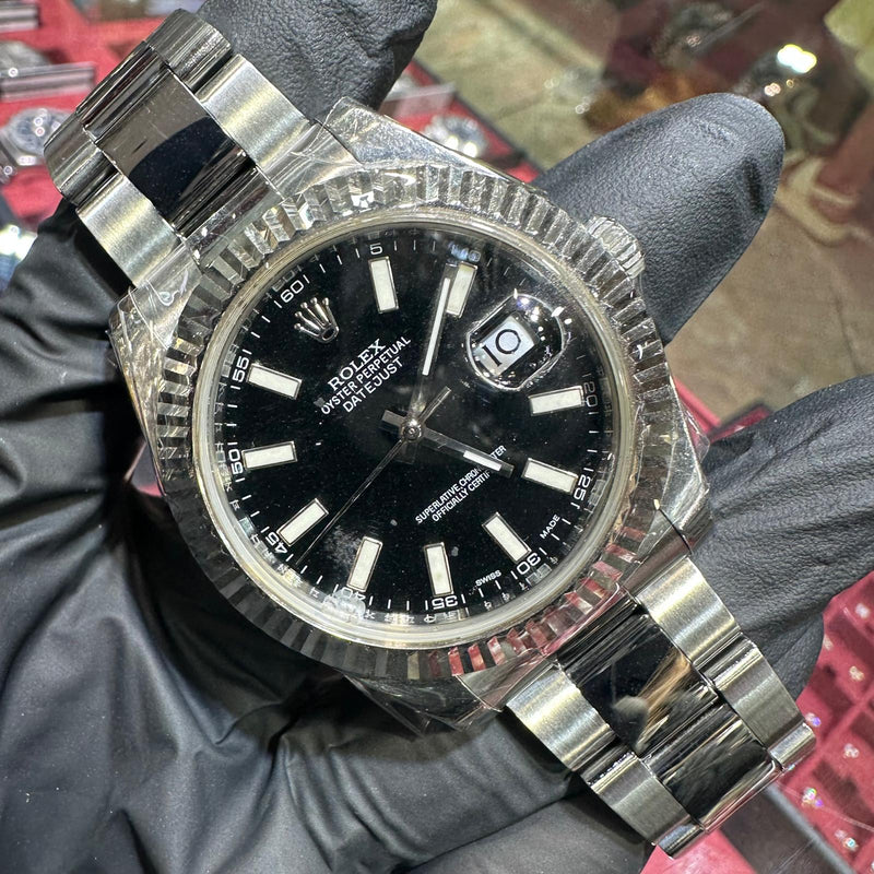 Rolex DateJust 41mm stainless steel watch with black stick dial and fluted bezel.