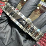 Stainless steel Rolex DateJust 41mm bracelet with polished center links and logo clasp.