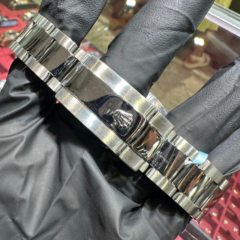 Stainless steel Rolex DateJust 41mm bracelet with polished center links and logo clasp.