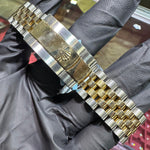 Rolex DateJust 41mm two-tone yellow gold Jubilee bracelet with signature clasp logo.