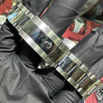 Rolex DateJust 41mm stainless steel bracelet with polished center links and clasp logo.
