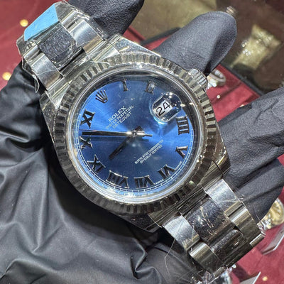 Rolex DateJust 41mm stainless steel watch with blue Roman dial and fluted bezel.