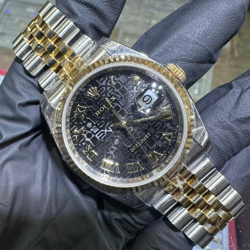 Rolex DateJust 36mm two-tone gold watch with black Roman numeral dial and jubilee bracelet.
