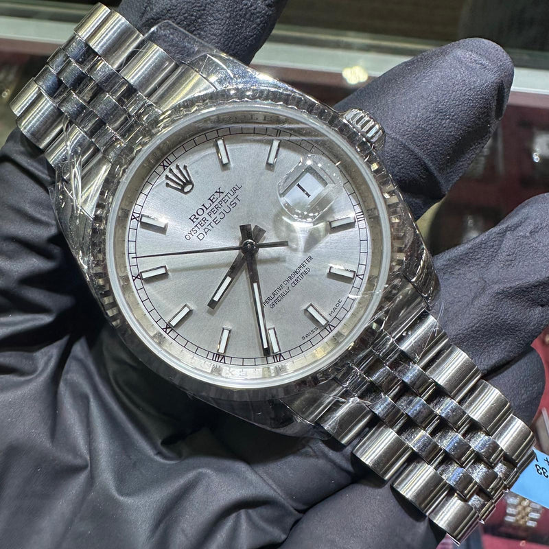 Rolex DateJust 36mm stainless steel watch with silver stick dial and Jubilee bracelet.