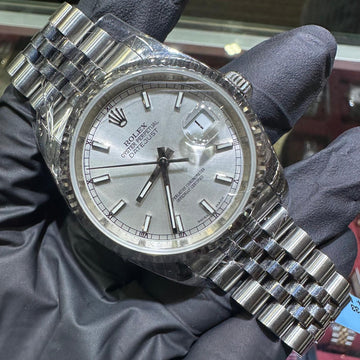 Rolex DateJust 36mm stainless steel watch with silver stick dial and Jubilee bracelet.