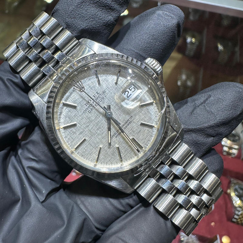 Rolex DateJust 36mm stainless steel watch with silver stick dial and jubilee bracelet.