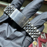 Rolex DateJust stainless steel Jubilee bracelet with polished clasp and embossed crown logo.