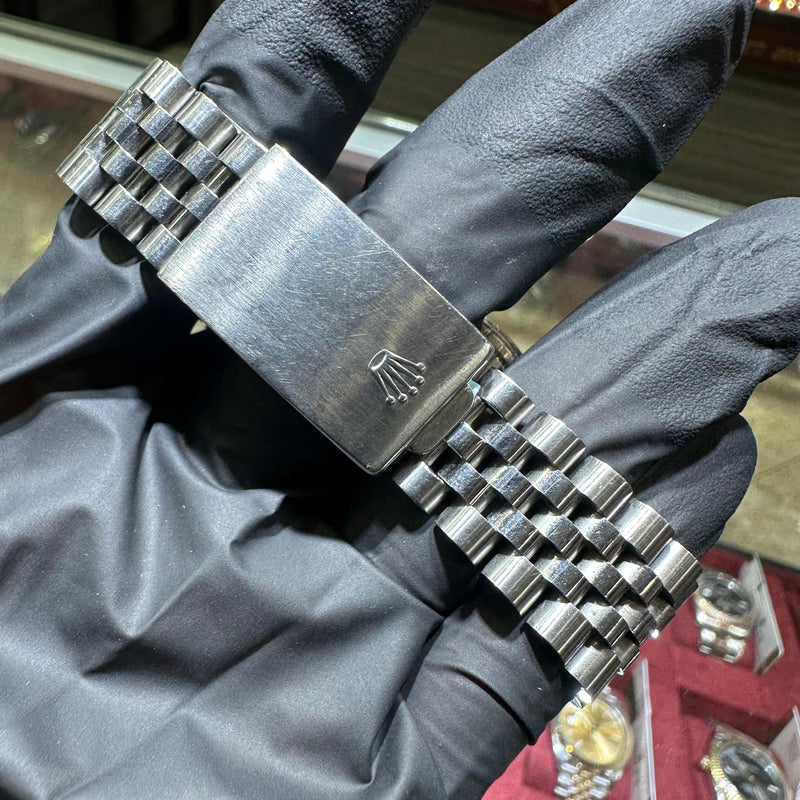 Rolex DateJust stainless steel Jubilee bracelet with polished clasp and embossed crown logo.