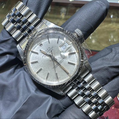 Rolex DateJust 36mm stainless steel watch with silver stick dial and Jubilee bracelet.