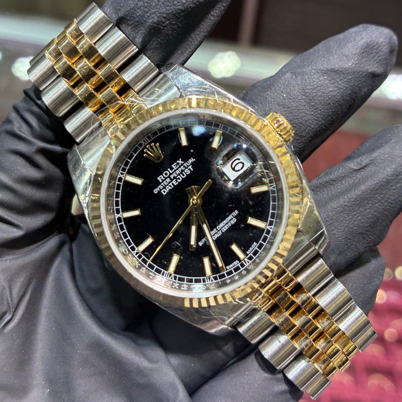 2011 Rolex Datejust 36mm in two tone Oystersteel and 18K yellow gold with a black stick dial and fluted bezel, ref 116233