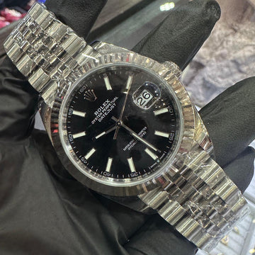 2023 Rolex Datejust 41mm in stainless steel with a black stick dial and fluted bezel