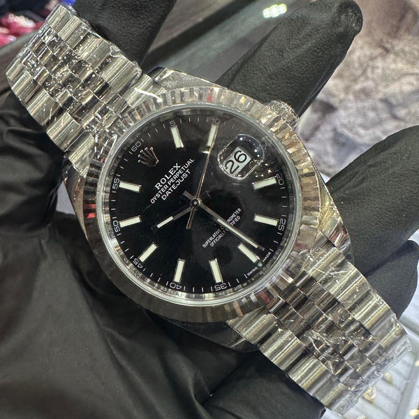 2023 Rolex Datejust 41mm in stainless steel with a black stick dial and fluted bezel