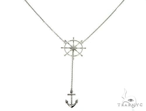 White gold anchor cable chain necklace with round-cut diamond accents, flat lay view showing link detail
