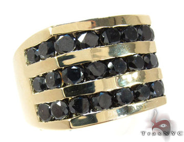Yellow gold ring with three channel-set rows of round black diamonds, wide band design.