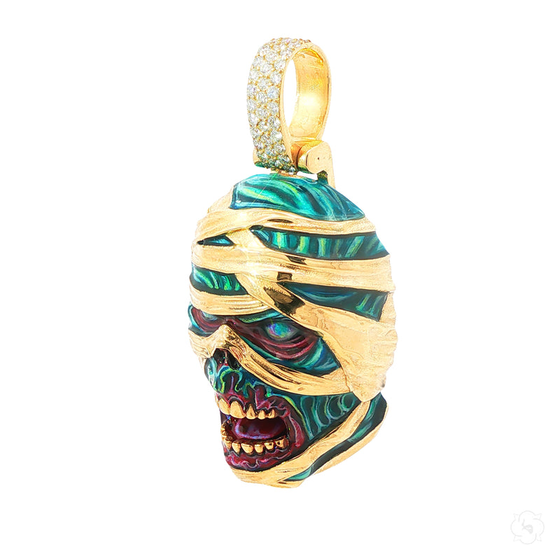 Yellow gold mummified zombie pendant with glow-in-the-dark enamel and diamond accents.