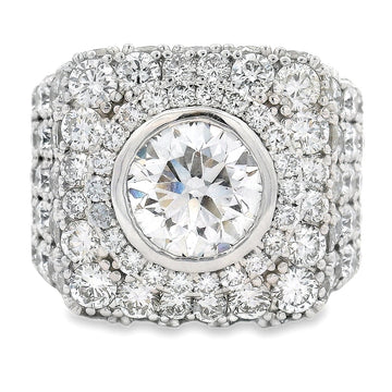 Square white gold men's pinky ring with central round diamond and pave diamond halo.