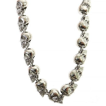 Silver chain necklace featuring detailed skull-shaped links with a polished finish.