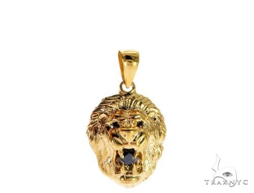 Yellow gold lion head pendant with black diamond eyes and detailed mane design.
