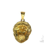 Yellow gold lion head pendant with black diamond eyes and detailed mane design.