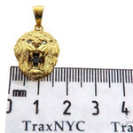 Yellow gold lion head pendant with black diamond eyes and detailed mane design.