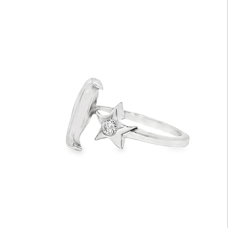 Sterling silver adjustable ring with crescent moon and small star detail.