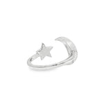 Sterling silver adjustable ring with crescent moon and small star detail.