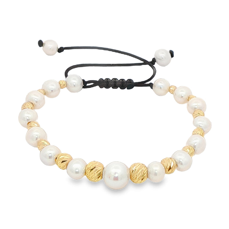 Unisex pearl bead bracelet with gold accents and adjustable black cord closure.