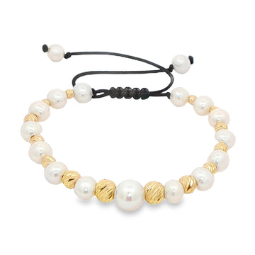 Unisex pearl bead bracelet with gold accents and adjustable black cord closure.