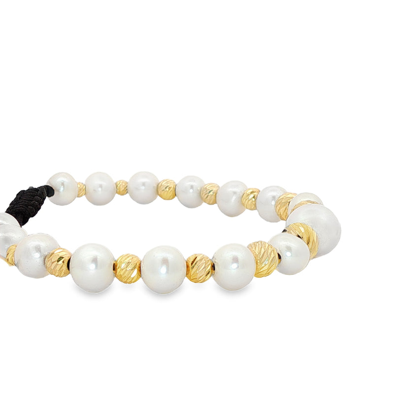 Unisex pearl bead bracelet with gold accents and adjustable black cord closure.